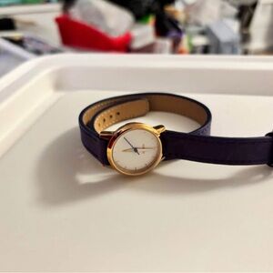 Elegant Nixon Gold and Blue Women's Watch